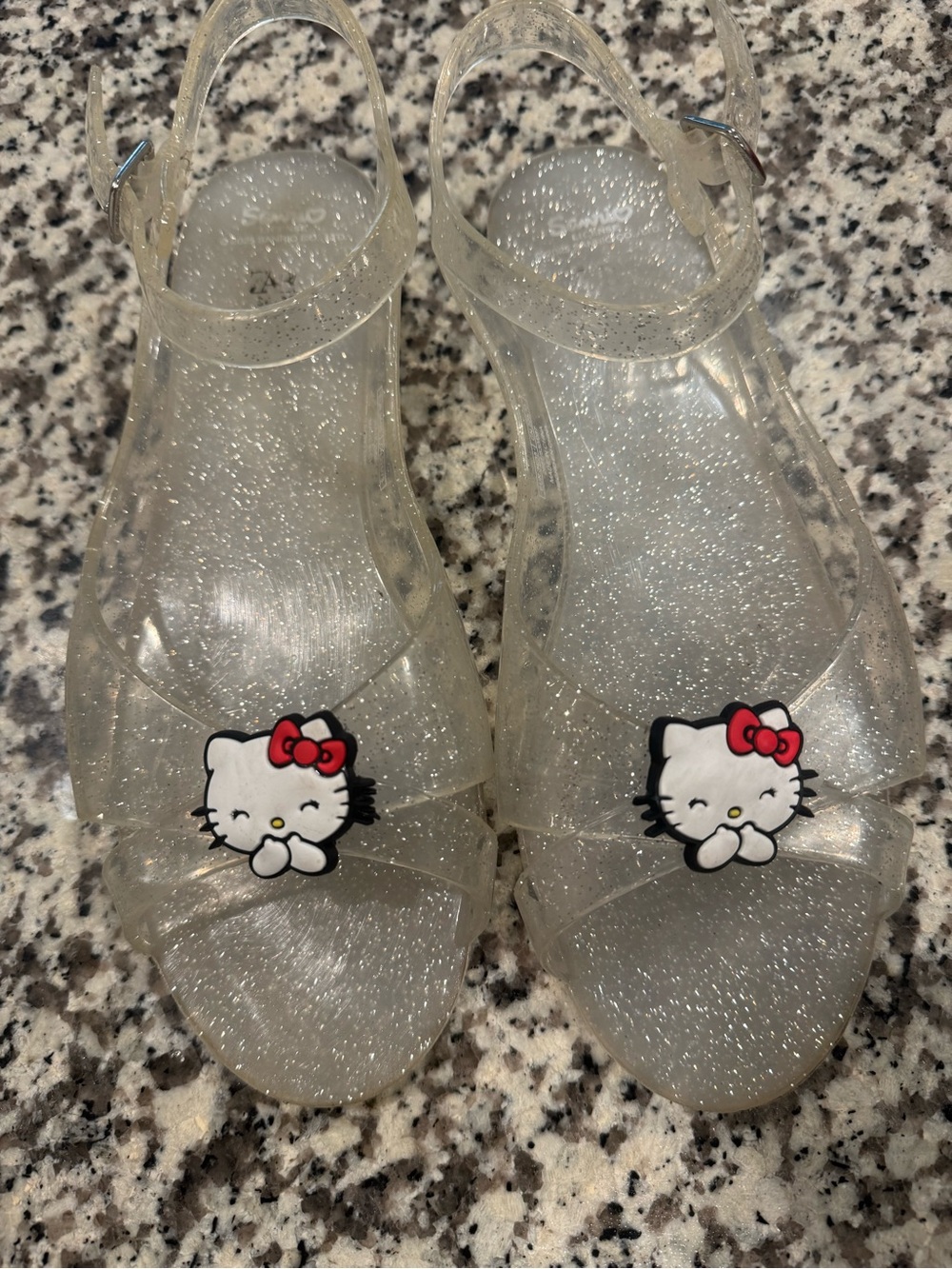 Sanrio Hello Kitty Clear Glitter Jelly Sandals with Red Bow Accents
